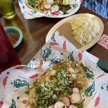 El Tio Taqueria - Shrimp tacos on corn tortillas topped with cilantro @ onions, side of rice & beans, with the chicken tacos in the back. - Mexican Near Me - Baton Rouge, Louisiana El Tio Taqueria - Shrimp tacos on corn tortillas topped with cilantro @ onions, side of rice & beans, with the chicken tacos in the back. - Mexican Near Me - Baton Rouge, Louisiana