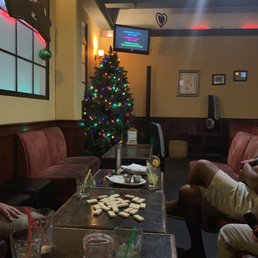 a group of people sitting around a table a group of people sitting around a table