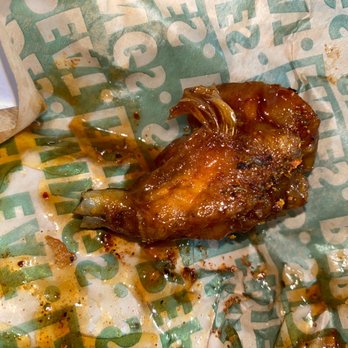 Wingstop - feathers still on the cooked chicken they sold me. - Chicken Wings Near Me - Beaumont, California