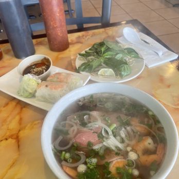 Saigon Noodle House - a bowl of soup and a plate of shrimp - Vietnamese Near Me - Merrillville, Indiana