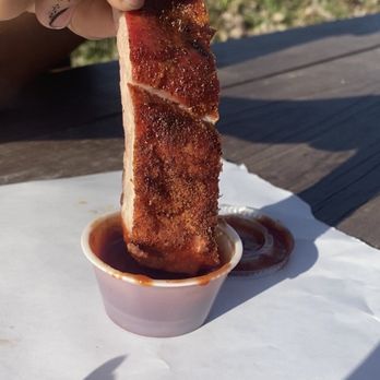 Motherwells BBQ - a hand holding a piece of meat - Barbeque Near Me - Lowry Crossing, Texas Motherwells BBQ - a hand holding a piece of meat - Barbeque Near Me - Lowry Crossing, Texas