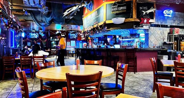 Photo of Dirty Al's Seafood Market & Cajun Kitchen - Brownsville, TX, US. tables and chairs