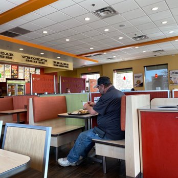 Del Taco - a man sitting at a table in a restaurant - Tex-Mex Near Me - Hiram, Georgia