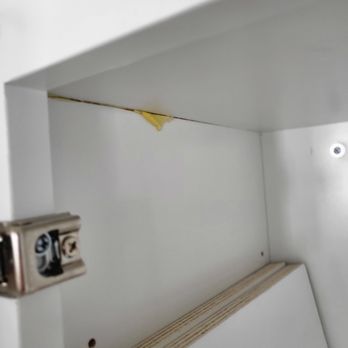 Dream Kitchen & Baths - Oozing glue in one cabinet and peeling paint on the other side. - Kitchen & Bath Near Me - Ormond Beach, Florida