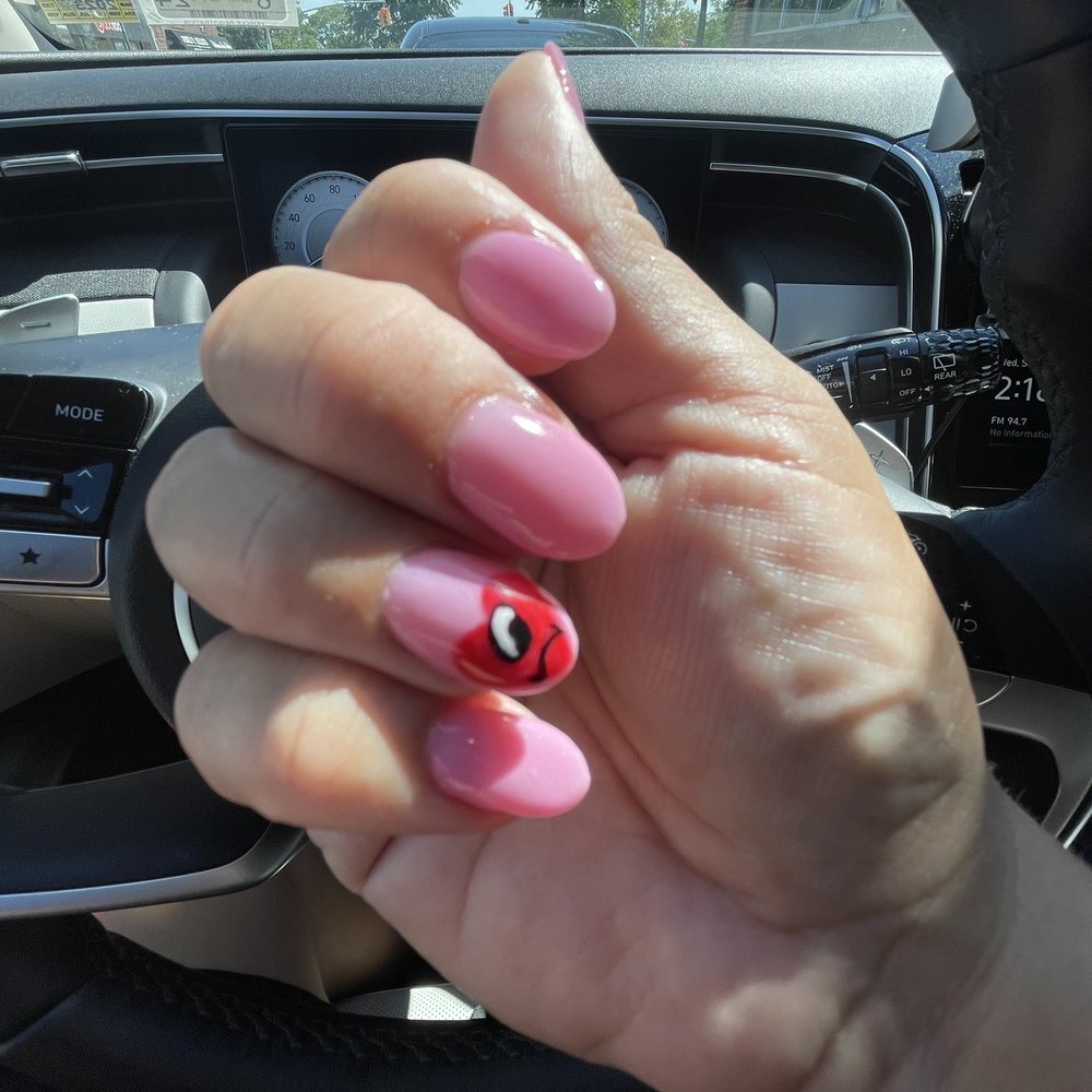 Flawless Nail Spa - My bad bunny nails "Un verano sin ti", with the heart and one eye. My favorite! - Nail Salons Near Me - Whitestone, New York