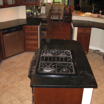 Mastery Tile & Stone - a kitchen with a stove - Flooring Near Me - Santa Paula, California Mastery Tile & Stone - a kitchen with a stove - Flooring Near Me - Santa Paula, California
