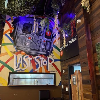 The Last Stop - a mural on the wall of a restaurant - Bars Near Me - Bronx, New York