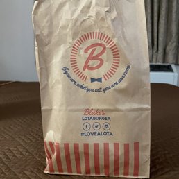 a paper bag on a bed