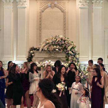 Carol Flowers Studio - Bouquet toss, flower arch in the background, & sweet heart table. - Florists Near Me - Fresh Meadows, New York