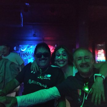 Cowabungas Bar - a group of people at a bar - Gay Bars Near Me - San Antonio, Texas