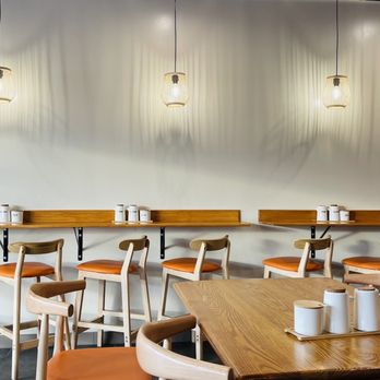 Linglon - a row of tables and chairs in a restaurant - Chinese Near Me - Denver, Colorado