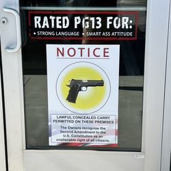 I noticed this sign as I pulled in and thought it was a "No firearms" sign. Fortunately this business supports the 2A!