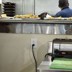 The Omelet House - Counter view of hot food coming out of kitchen.