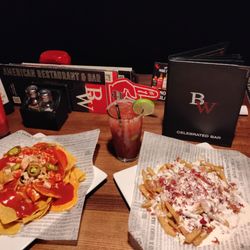 Cheese fries, nachos, strawberry daiquiri and a bloody Mary