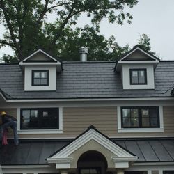 Cousins Construction - GAF Tru-Slate and Black Standing Seam Metal.