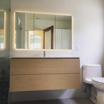 Sermag Construction - a bathroom with a toilet and sink - General Contractors Near Me Sermag Construction - a bathroom with a toilet and sink - General Contractors Near Me