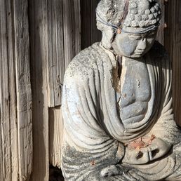 Repaired Buddha statue near the bathrooms Repaired Buddha statue near the bathrooms
