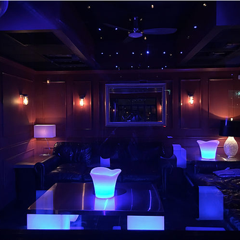 Pier 132 - a dimly lit room with leather couches - Venues & Event Spaces Near Me - Bronx, New York