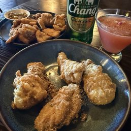Wing zaap, fried pork belly, lychee martini and Thai beer