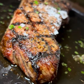 The Loaded Spoon - a piece of steak on a plate - Cocktail Bars Near Me - Freehold, New Jersey