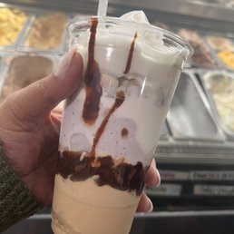 Coffee ice cream, Lavender honey ice cream on top, Hot fudge between, Topped w/almonds, mallo cream, whipped cream, & choc chips