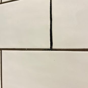 Tile and Grout Magician - Hard to see- but the epoxy looks black and sticks out - Grout Services Near Me