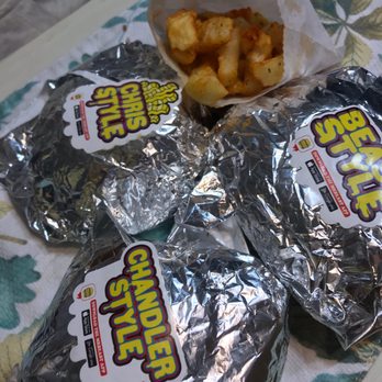 MrBeast Burger - three bags of fries on a table - Food Delivery Services Near Me MrBeast Burger - three bags of fries on a table - Food Delivery Services Near Me
