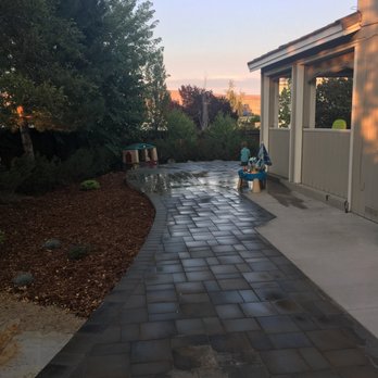Century Landscapes - a walkway with a bench in the foreground - Landscaping Near Me - Reno, Nevada