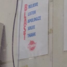 This sign that is visible at the drive thru window is posted to remind the employees to: Believe Listen Apologize Solve Thank This sign that is visible at the drive thru window is posted to remind the employees to: Believe Listen Apologize Solve Thank