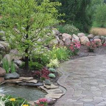 Traboscia - a garden with a stone wall and water feature - Landscaping Near Me - Morton, Pennsylvania