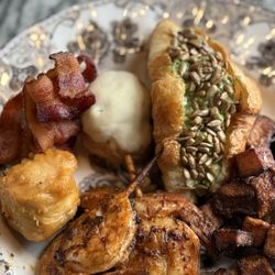 Manna Uptown - Shrimp skewers, potatoes, chicken salad croissant, bacon, puff pastry filled