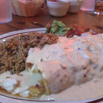 Border Cafe - Creamy spicy sauce covering seafood-filled enchiladas and Jambalaya on the side! - Cajun/Creole Near Me - Newark, Delaware