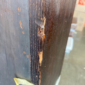 Hansen Bros. Moving & Storage - Cracked antique China hutch that was uncovered, unprotected, and had fallen over, leaning at an angle in the vault. - Movers Near Me - Seattle, Washington