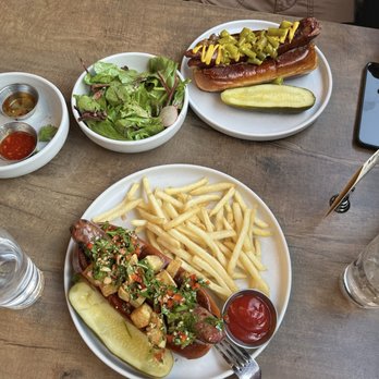 Miskatonic - Bottom: sausage (brat) with house made chutney. Top: polish sausage. Both sausages were very filling and rich. - Tapas/Small Plates Near Me - Naperville, Illinois