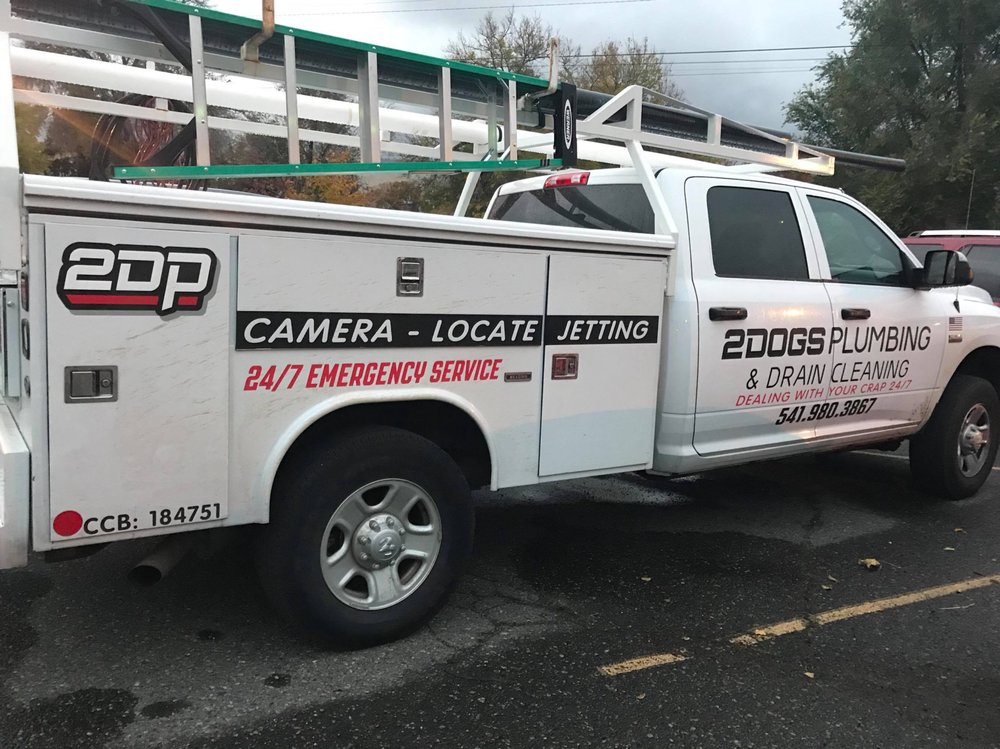 Slide of Two Dogs Plumbing and Drain Cleaning