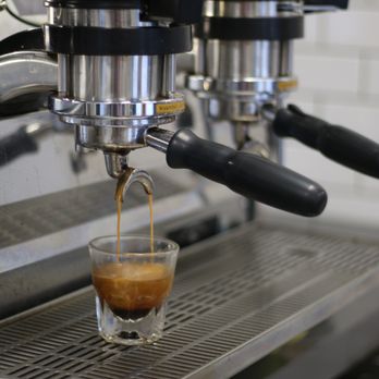 Sidecar Coffee Grand Crossing - a espressor being filled with coffee - Coffee & Tea Near Me - Waterloo, Iowa Sidecar Coffee Grand Crossing - a espressor being filled with coffee - Coffee & Tea Near Me - Waterloo, Iowa