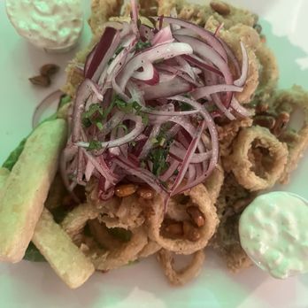 Lima Limón Peruvian Restaurant - Chicharron de Calamar. Deep fried breaded. Calamari served with yucca and onion garnish. The picture doesn't do it justice. - Peruvian Near Me - Santa Clarita, California Lima Limón Peruvian Restaurant - Chicharron de Calamar. Deep fried breaded. Calamari served with yucca and onion garnish. The picture doesn't do it justice. - Peruvian Near Me - Santa Clarita, California