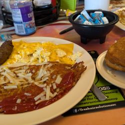 Nannie Annie's Breakfast & Lunch - Two hard-fried scrambled eggs with American cheese, home fries, country sausage, and fresh biscuit.