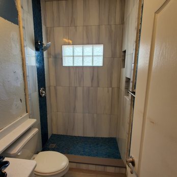 Affordable Shower - a toilet and shower in a small bathroom - General Contractors Near Me Affordable Shower - a toilet and shower in a small bathroom - General Contractors Near Me