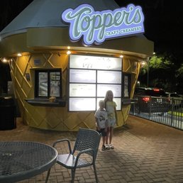 a woman standing outside at night a woman standing outside at night