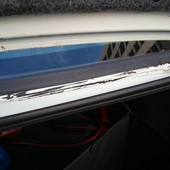 Fernandez Auto Glass & Repair - More of the black glue, below the trunk lid. - Auto Glass Services Near Me - Chicago, Illinois