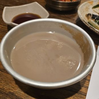 Cho Dang Gol - Makgeolli (rice wine). Pear flavored. Served in a tin bowl. - Korean Near Me - New York, New York Cho Dang Gol - Makgeolli (rice wine). Pear flavored. Served in a tin bowl. - Korean Near Me - New York, New York