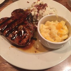 O'Charley's Restaurant & Bar - Bone in pork chop with bacon mash and mac and cheese.