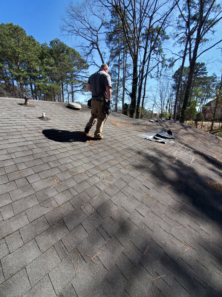 Slide of The Roofing Specialists