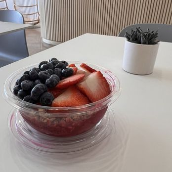 Pure Green - Pitaya bowl and seat view from the booth like seats - Juice Bars & Smoothies Near Me - Columbia, Maryland
