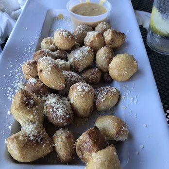 Mellow Mushroom Murrells Inlet - Pretzel Bites Parmesan Cheese shake on top served with Beer Cheese - Pizza Near Me - Murrells Inlet, South Carolina