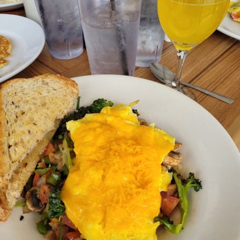 The Howling Rooster - The garden bowl ($13.99) with added bacon ($3.79), including multi grain toast, and a mango mimosa ($7). 3.5/5 - Breakfast & Brunch Near Me - Buffalo, New York
