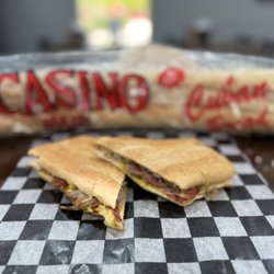 Hometown Deli - Our Cuban sandwich on authentic Cuban bread, mojo pork, sliced ham, Swiss cheese, pickles & mustard. Pressed to perfection