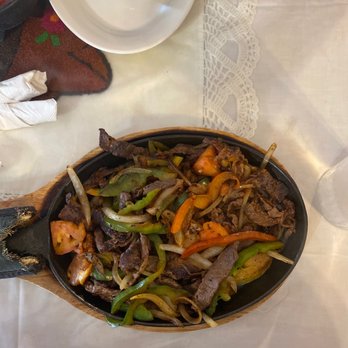 Rancho El Molcajete - beef and peppers in a skillet - Mexican Near Me - Mableton, Georgia Rancho El Molcajete - beef and peppers in a skillet - Mexican Near Me - Mableton, Georgia