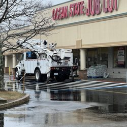 Ocean State Job Lot - They are fixing the sign on a rainy Thursday!